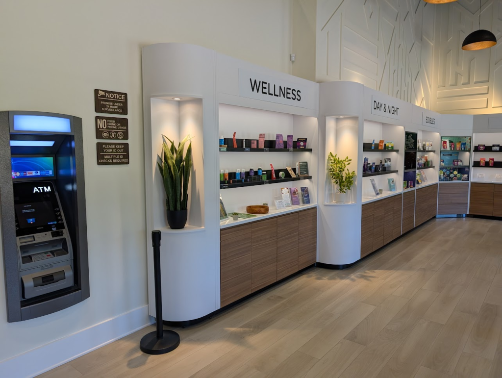 The Reserve Pasadena MD wellness display bay, curved white cabinetry with wood-grain base
